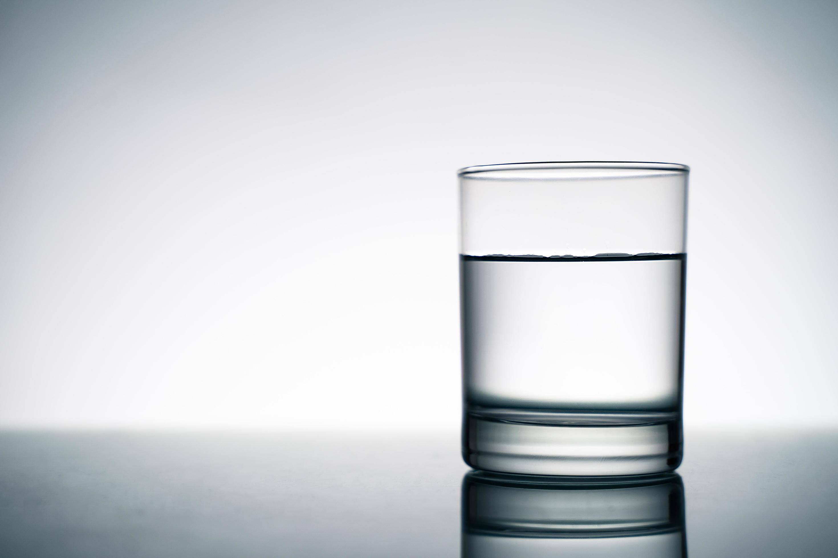 Refreshing glass of clear water with citrus slice